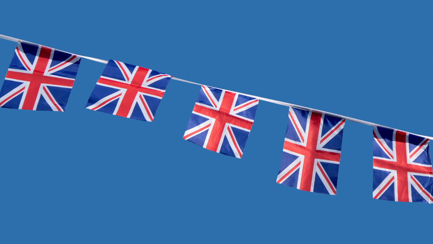 Union Flag bunting against a blue sky