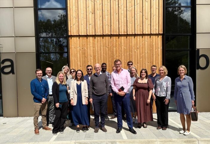 delegates outside new building