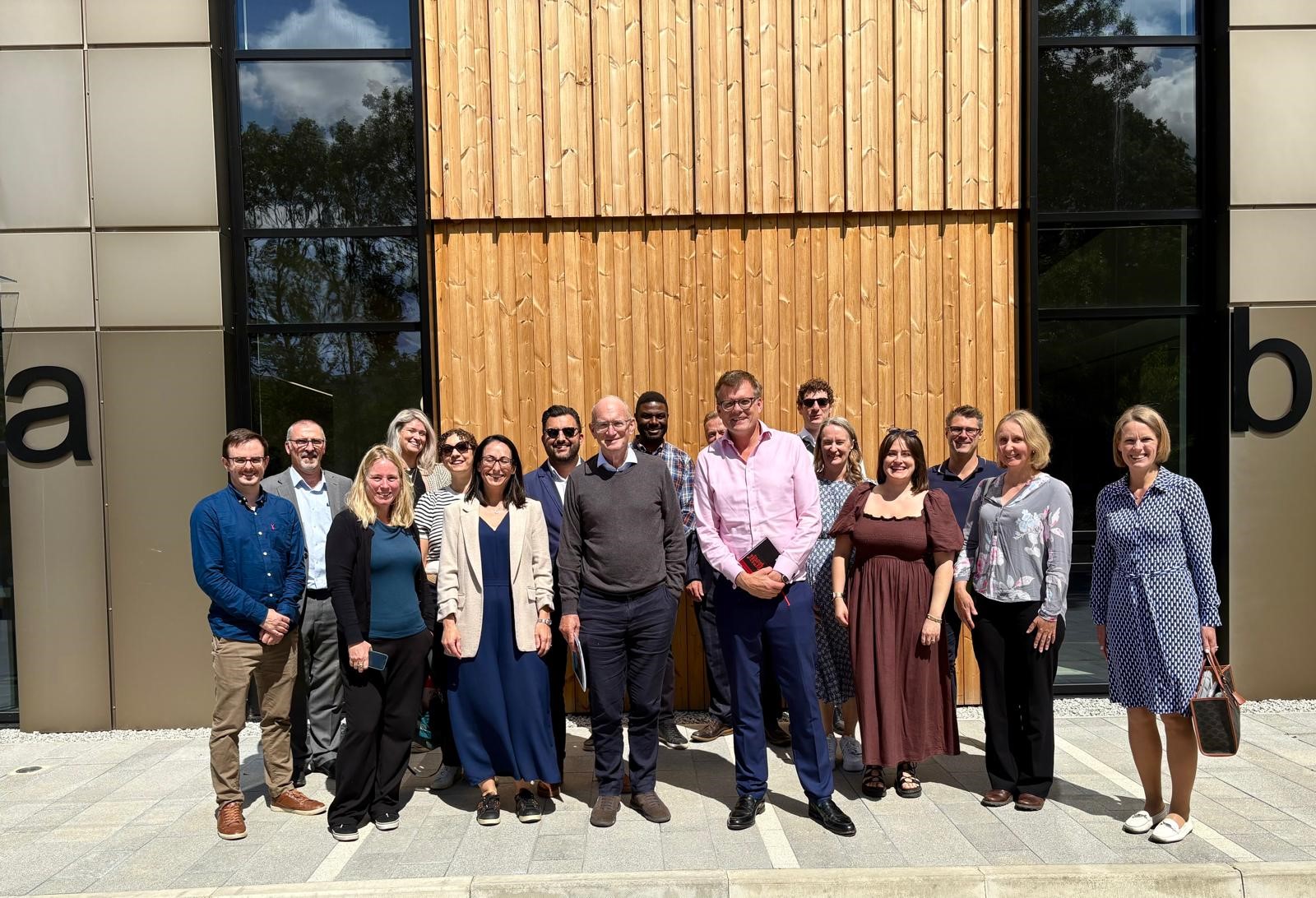 delegates outside new building