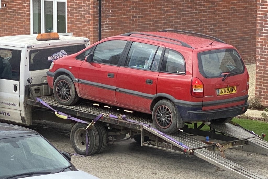 Car on the back of a tow truck