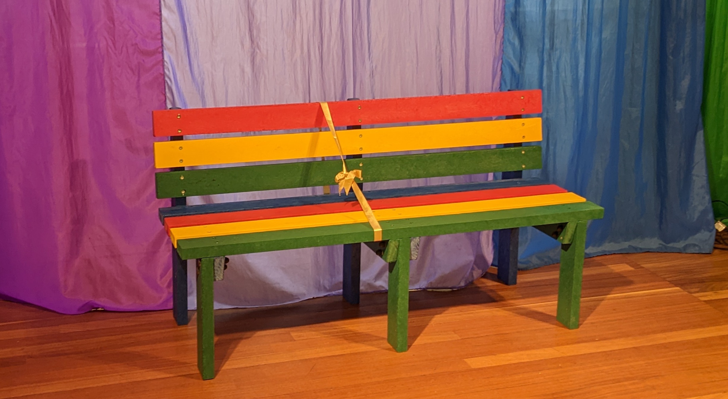 Council presents colourful bench to the winner of its litter bug trails competition 